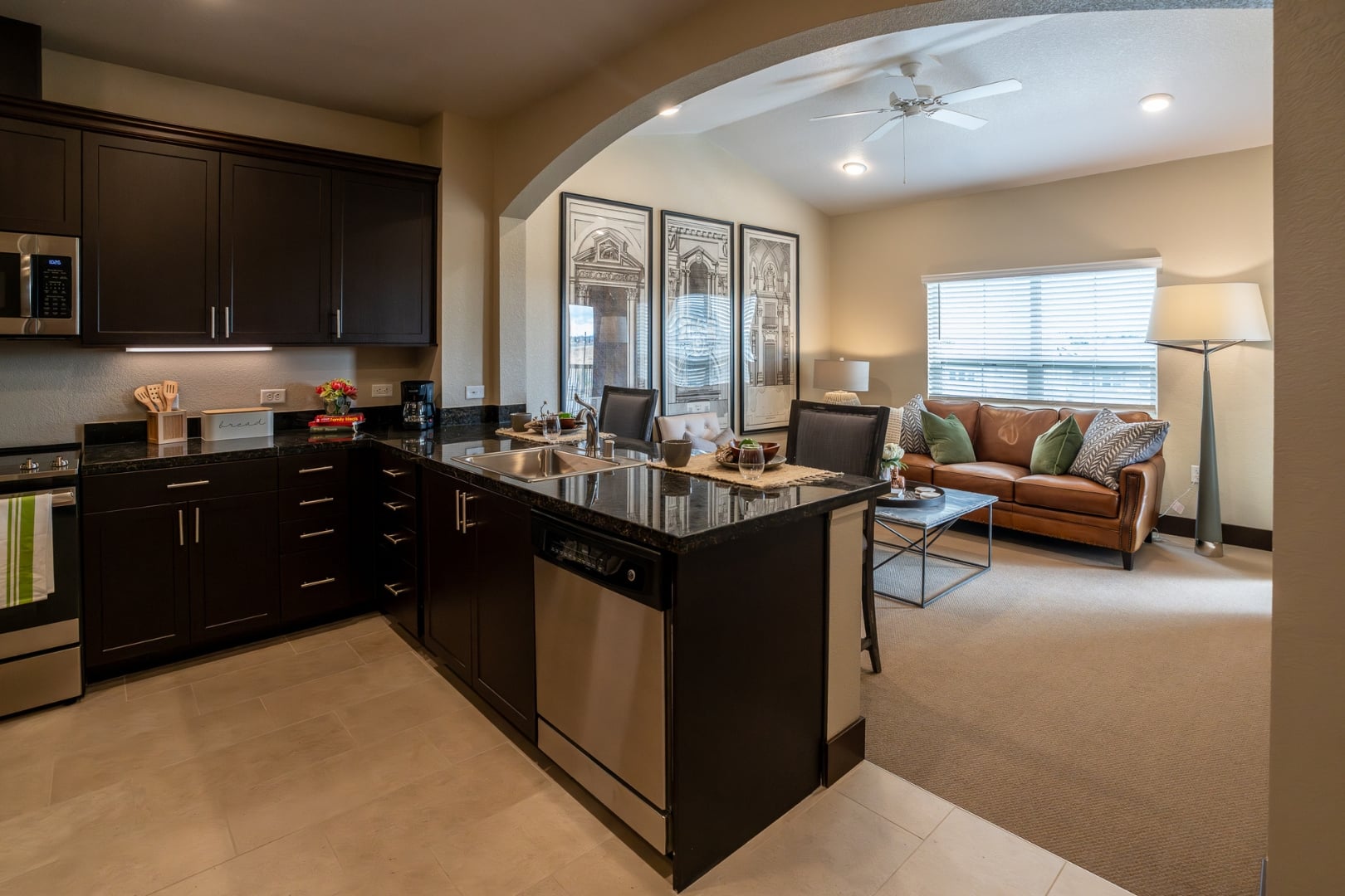Open Kitchen Overlooking Cozy Living Room at Independent Living Facility