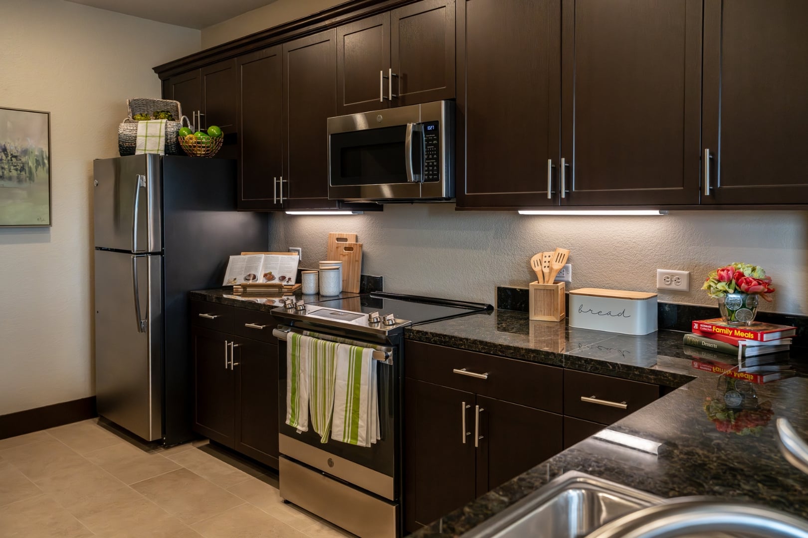 Kitchen Counter with Cookbooks and Flowers at Independent Living Facility