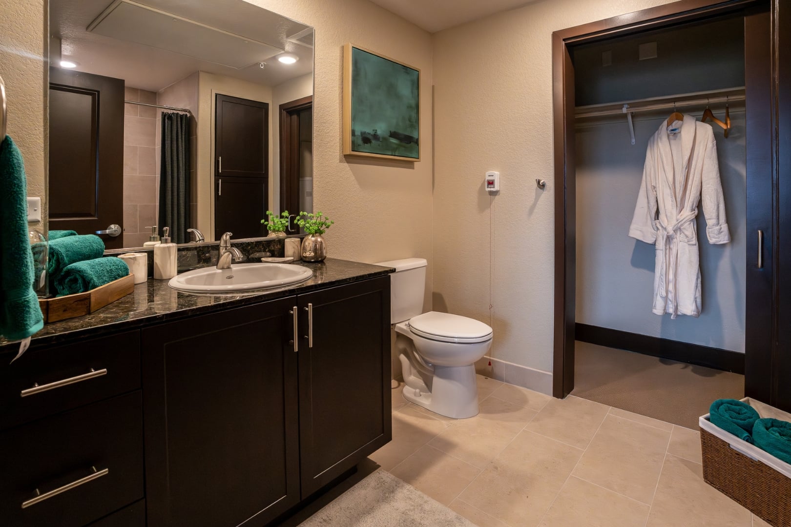 Bathroom Vanity with Closet and Robe at Independent Living Facility
