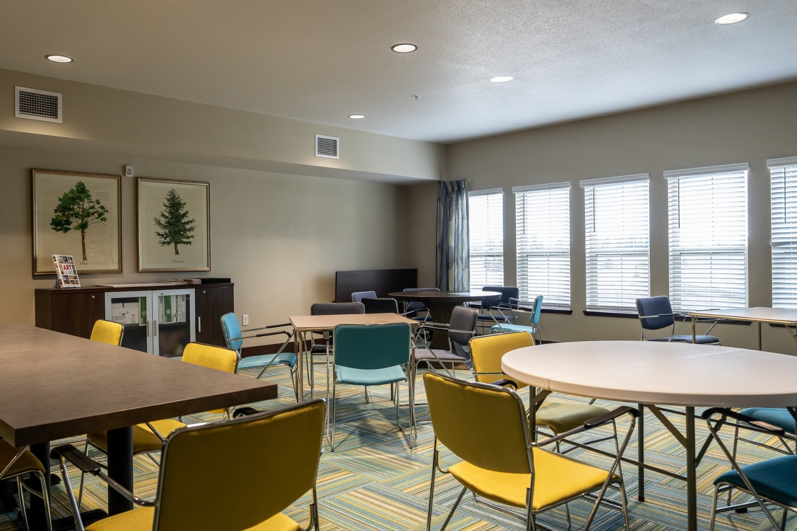 Meeting Room with Colorful Chairs at Independent Living Facility