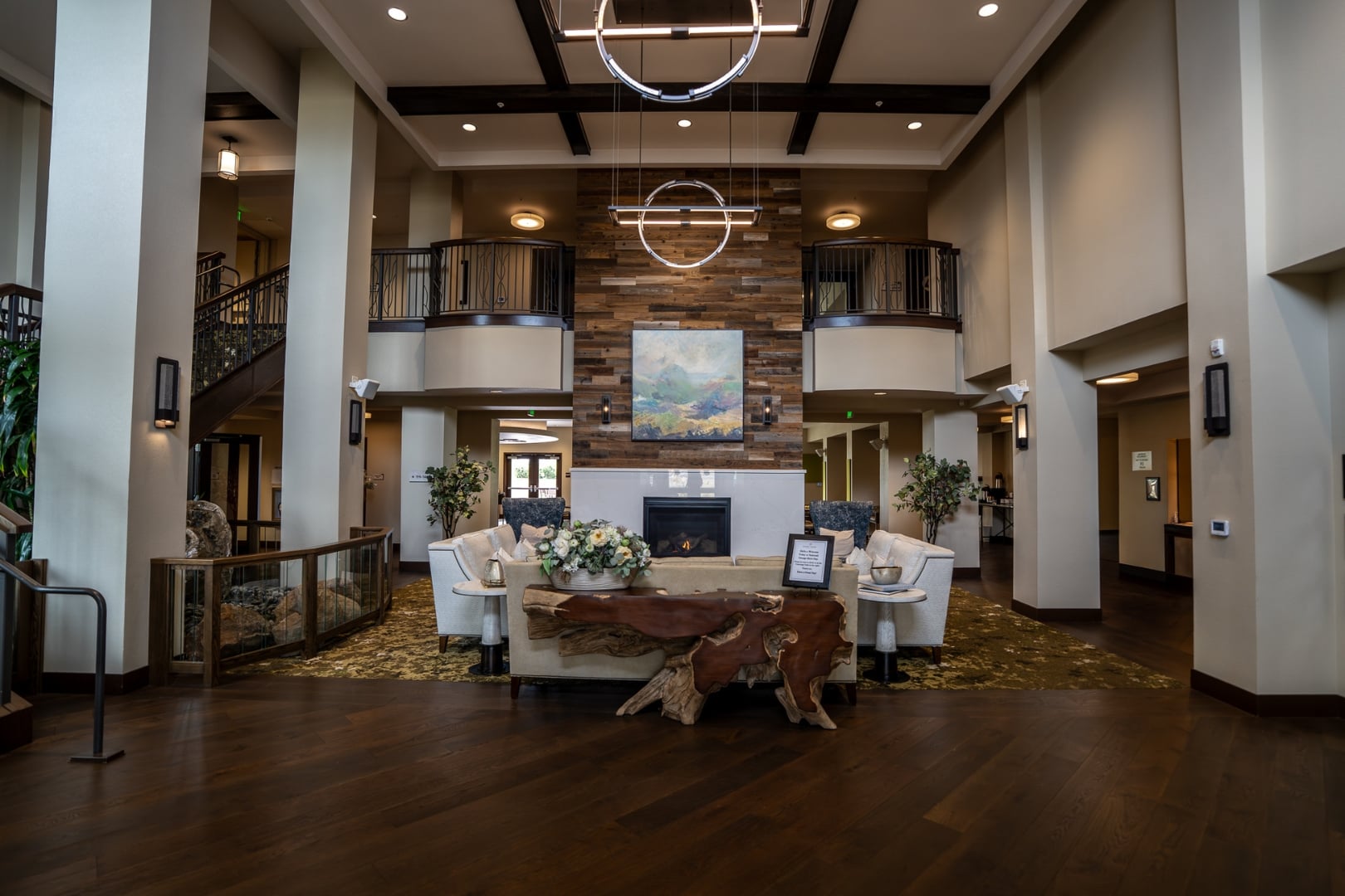 Lobby Fireplace with Wood Accent Wall at Independent Living Facility