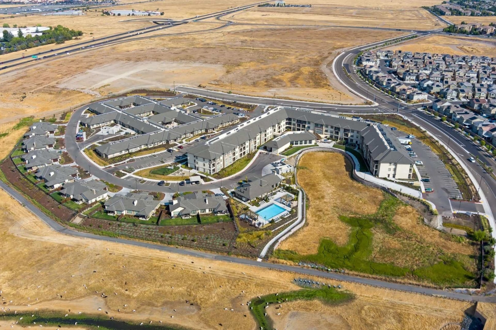 Aerial View of Pool and Rooftops at Independent Living Cottages