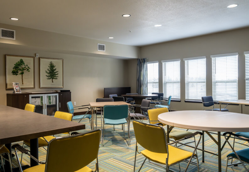 Activity Room with Tables and Chairs at Independent Living Facility Activity Room with Tables and Chairs at Independent Living Facility