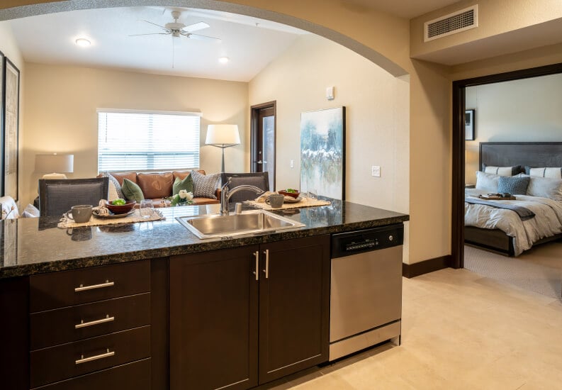 Open Concept Kitchen Overlooking Living Area at Independent Living Facility Open Concept Kitchen Overlooking Living Area at Independent Living Facility