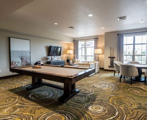 A Communal Hall in Independent Living Facility in Rocklin CA Billiards Table in Bright Game Room at Independent Living Facility