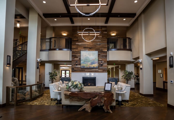 Grand Two Story Lobby with Fireplace at Independent Living Facility Grand Two Story Lobby with Fireplace at Independent Living Facility