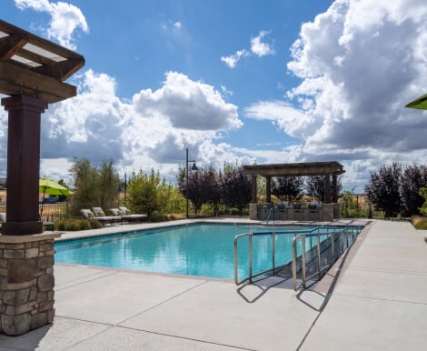 Pool Area with Covered Pergola Seating at Independent Living Facility Pool Area with Covered Pergola Seating at Independent Living Facility